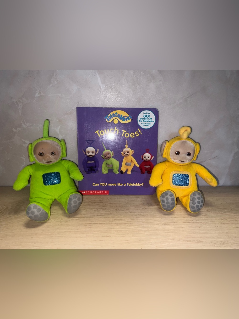 Teletubbies Touch Toes! Purple Board Book with Green and Yellow Plush Toys